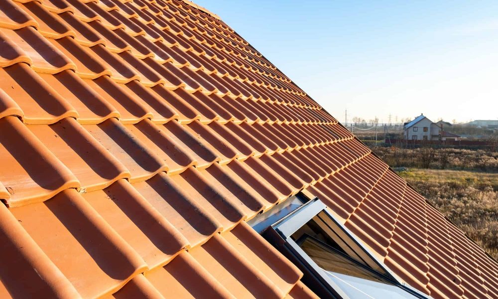 overlapping-rows-of-yellow-ceramic-roofing-tiles-covering-residential-building-roof.jpg