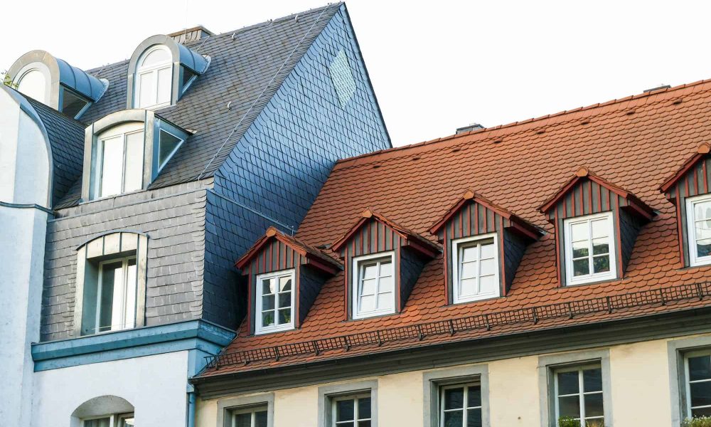 roofs-of-old-houses-with-roof-windows-and-orange-roof-tiles-in-german-city.jpg