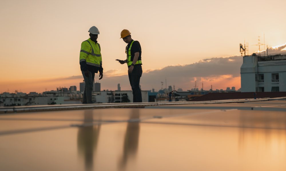 Service engineer checking solar cell on the roof for maintenance if there is a damaged part. Engineer worker install solar panel. Clean energy concept.